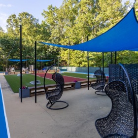 a group of chairs and tables outside